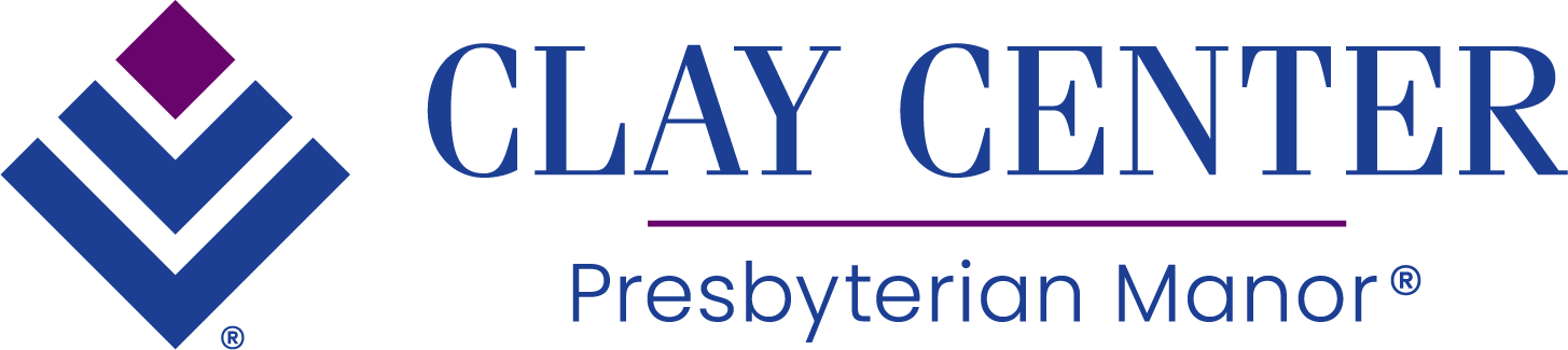 Logo of Clay Center Presbyterian Manor with a diamond-shaped design in blue and purple on the left and the text "Clay Center Presbyterian Manor" in blue on the right.