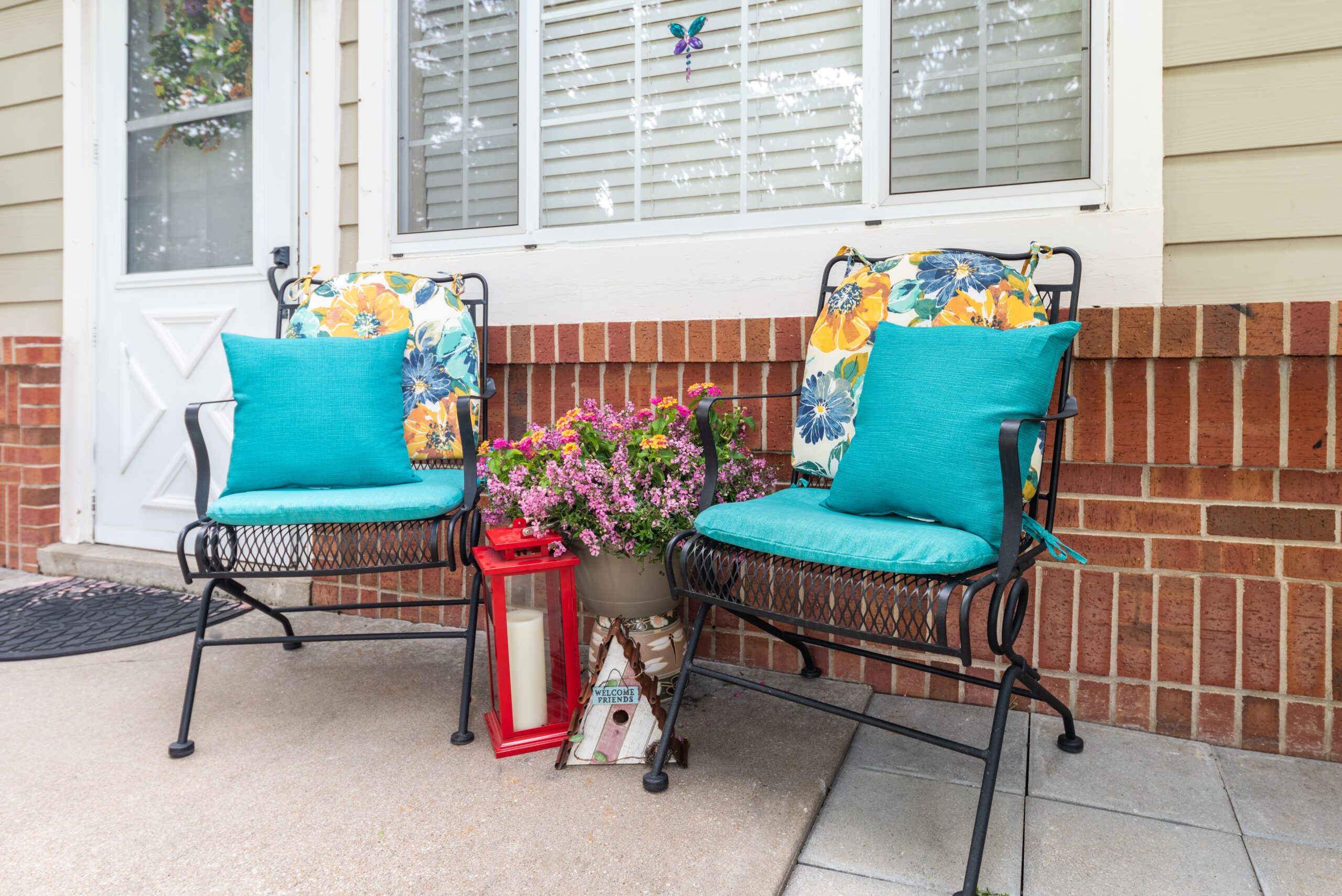 Photograhed by Rebekah Houser. FPSV apartment patio with chairs and flowers